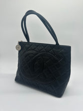 Load image into Gallery viewer, Authentic Chanel preowned black caviar medallion tote with silver hardware